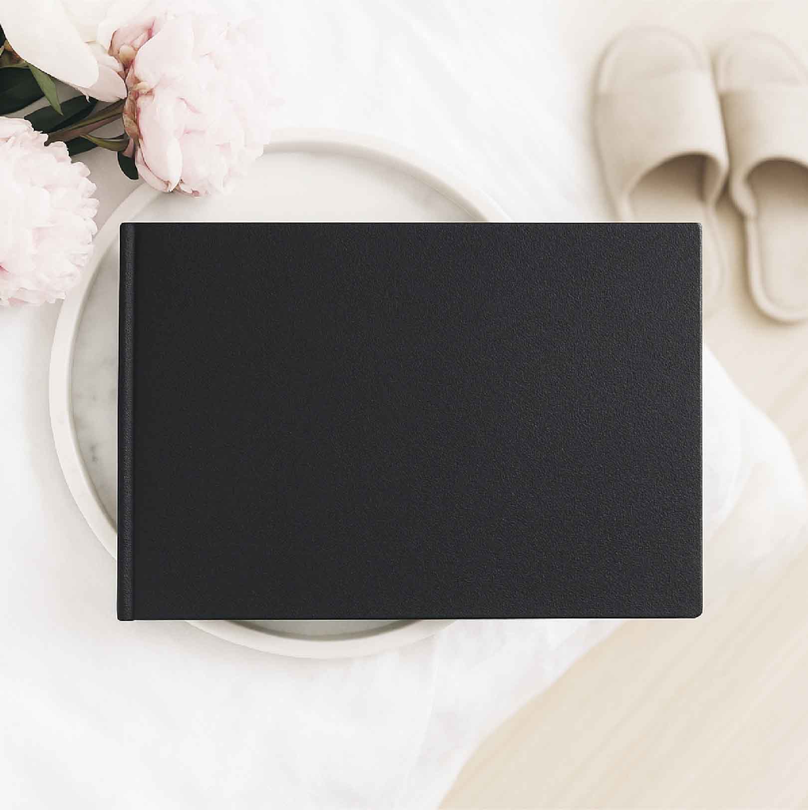 A4 landscape luxury hardcover photobook with premium cover finish and photo pages
