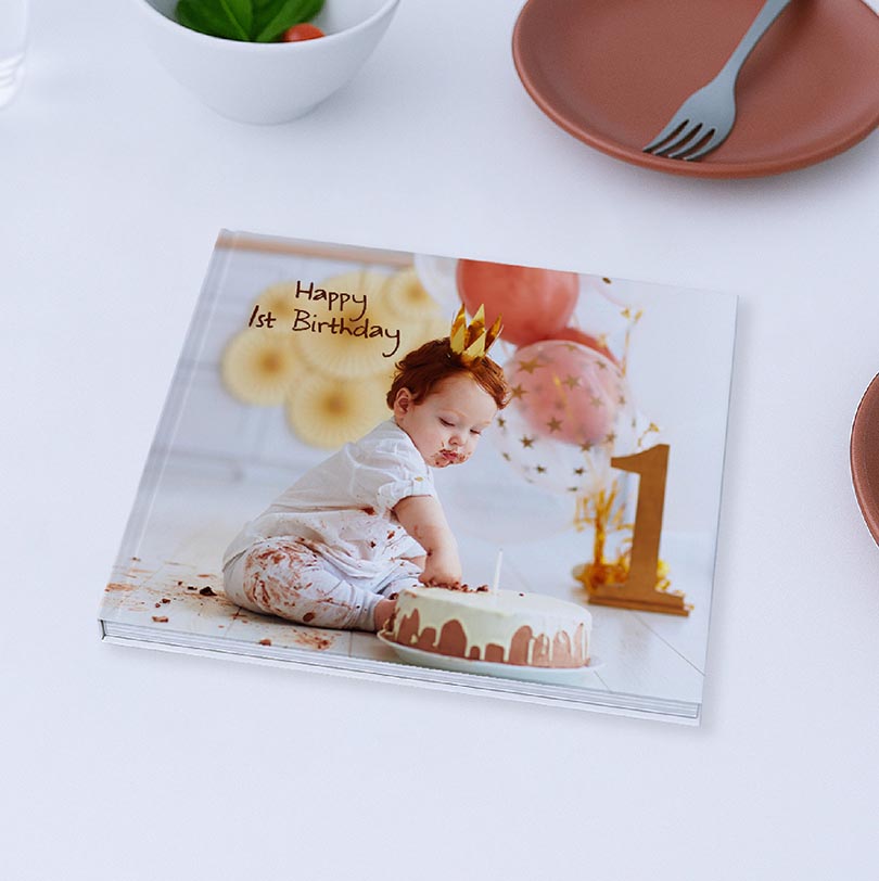 200x200 personalised hardcover photobook with 1st birthday party photos and themed cover design