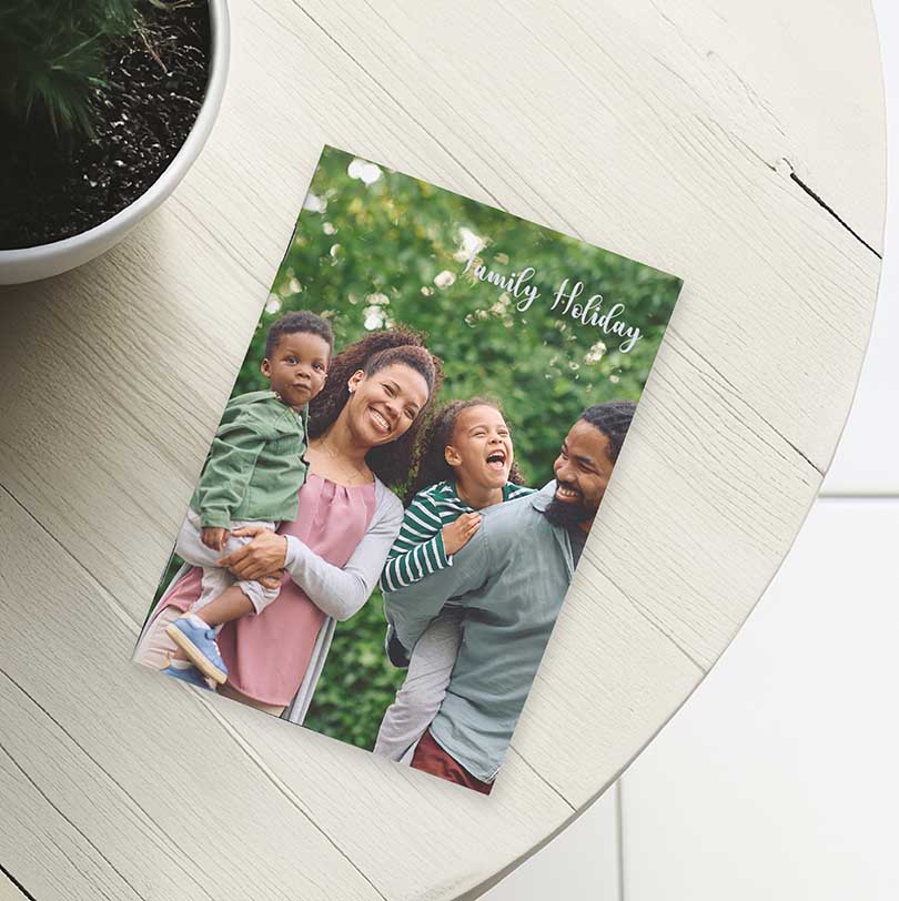 A4 portrait staple bound personalised softcover photobook with family holiday photos on cover design