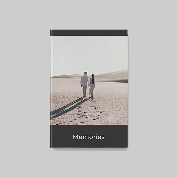 A4 portrait hardcover photobook with modern black AI theme showing personalised photos, sleek dark layouts and premium hardcover finish.