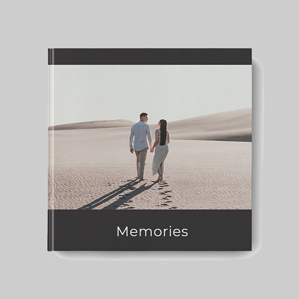 Square hardcover photobook with modern black AI theme showing personalised photos, sleek dark layouts and premium hardcover finish.