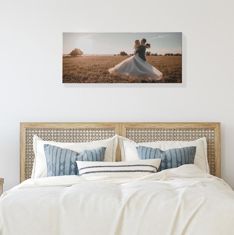 400x900mm stretched canvas print with photo of happy bride and groom smiling together at wedding