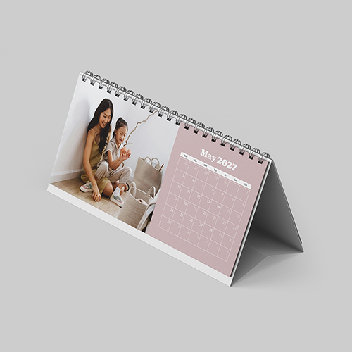 Desktop landscape boho themed personalised photo calendar placed on desk with stylish bohemian design and compact format