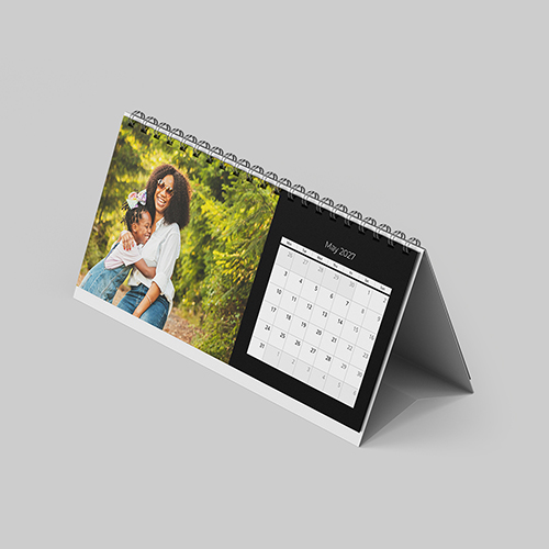 Desktop landscape minimalist black themed personalised photo calendar with clean layout and custom images.