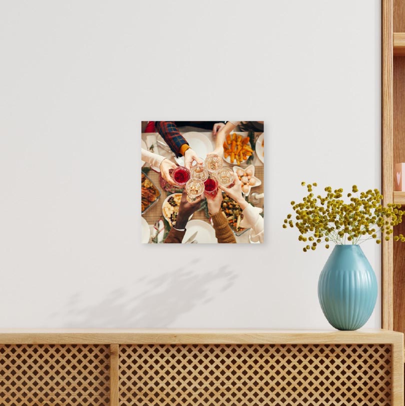 200x200mm foam board print with photo of people making toast at dinner table during meal celebration