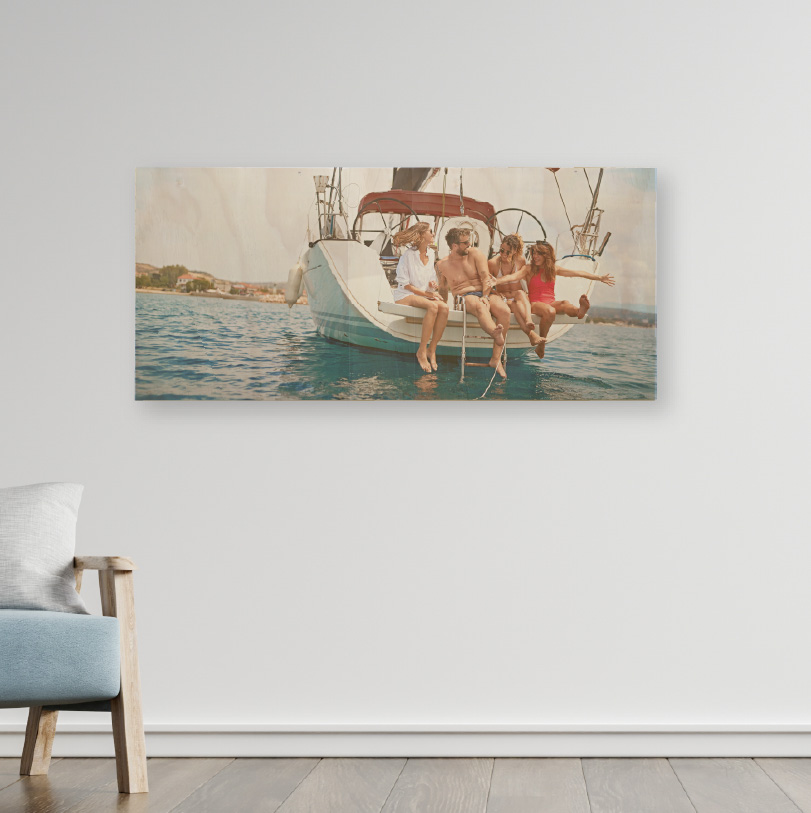 200x600mm birch wood photo print showing family sitting on sailboat on natural wooden panel