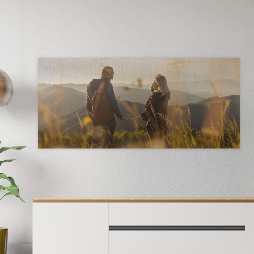 200x600mm brushed silver aluminium print with photo of couple on mountain looking at landscape view
