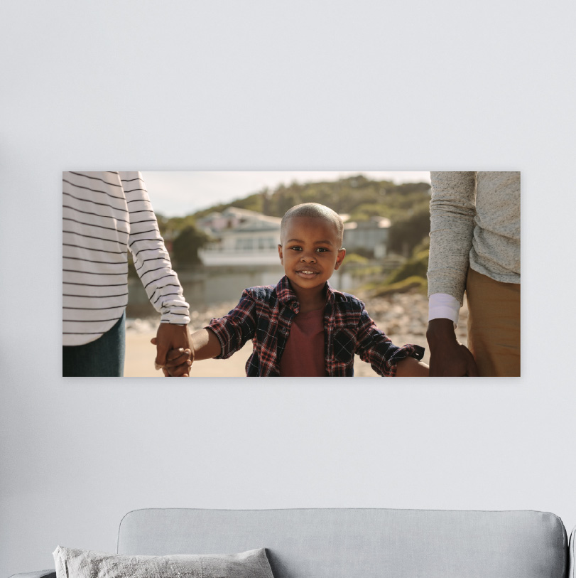 200x600mm foam board print with photo of kid holding hands with mother and father walking together outdoors