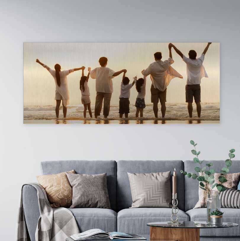 300x900mm brushed silver aluminium print with photo of family holding hands walking on beach together