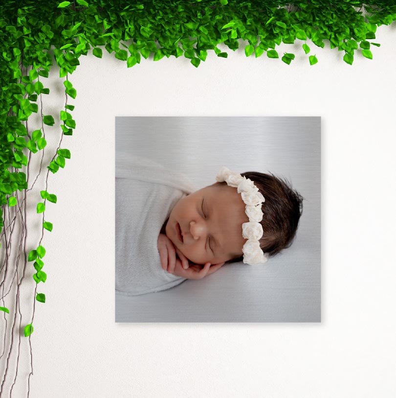 400x400mm brushed silver aluminium print with photo of a little baby sleeping peacefully