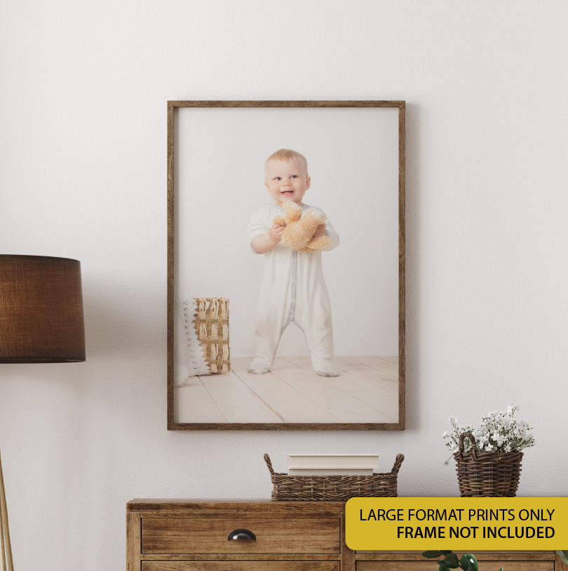400x500mm large format print with photo of baby holding teddy bear in a soft, warm, emotional portrait scene
