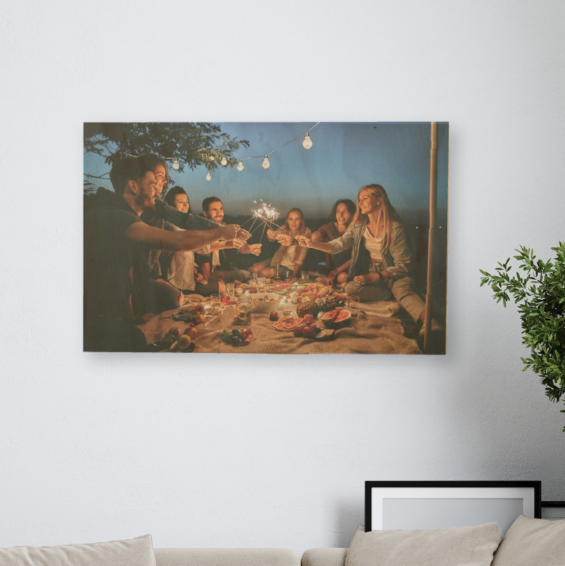 400x600mm birch wood photo print showing friends holding sparklers on natural wooden panel