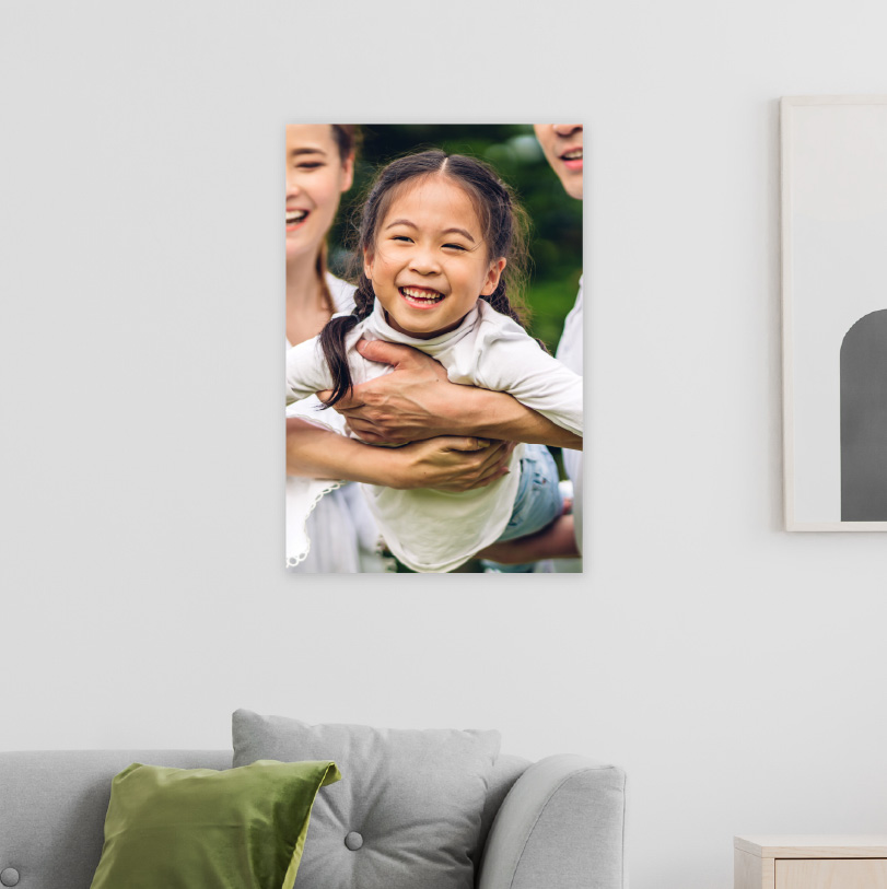 450x300mm foam board print with photo of parents holding daughter in flying position happily indoors or outdoors
