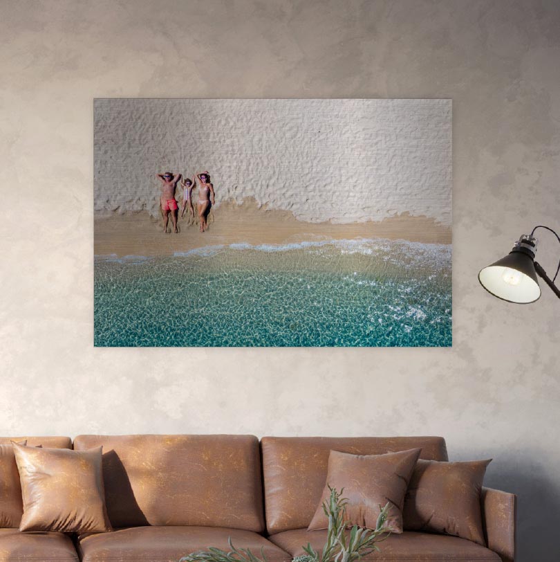 500x700mm brushed silver aluminium print with photo of family lying down on beach together outdoors