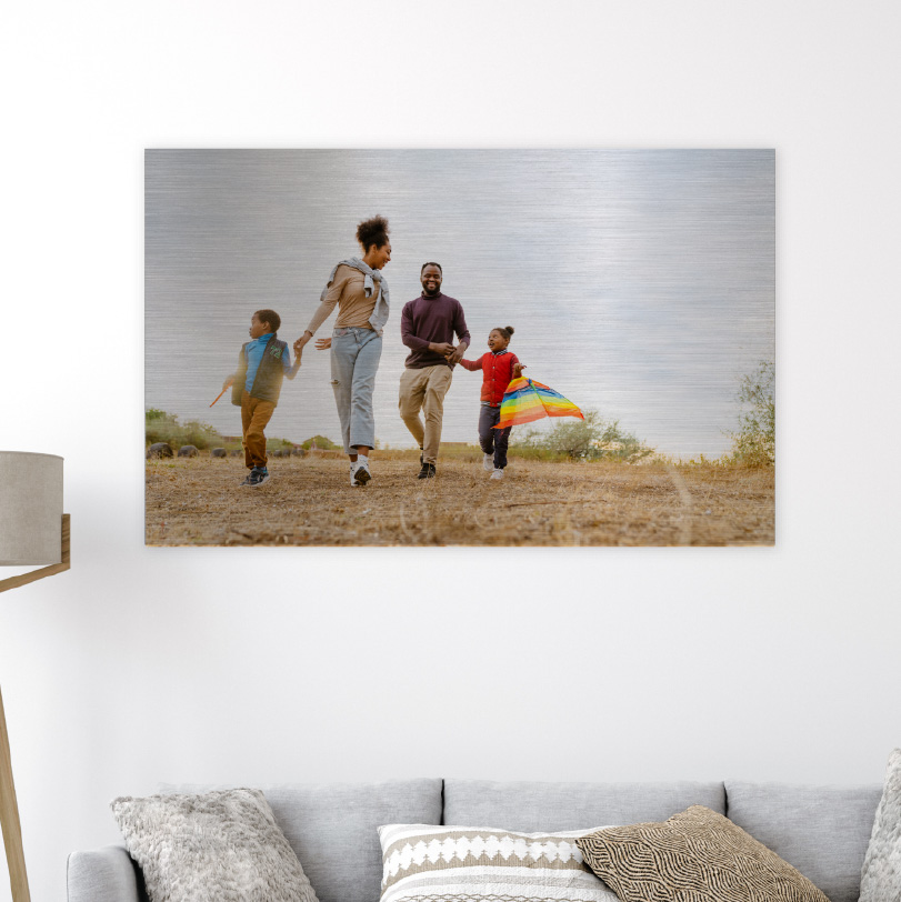 500x750mm brushed silver aluminium print with photo of family walking in field outdoors together