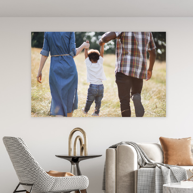 500x750mm foam board print with photo of mom and dad swinging son between them while walking happily outdoors
