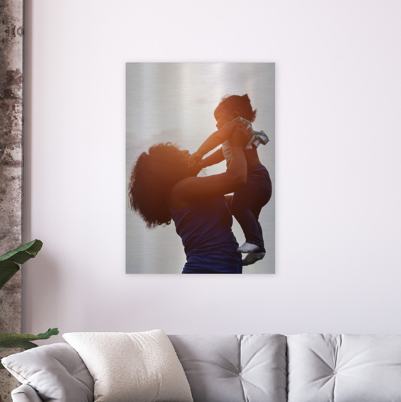 600x400mm brushed silver aluminium print with photo of mother holding baby in arms affectionately