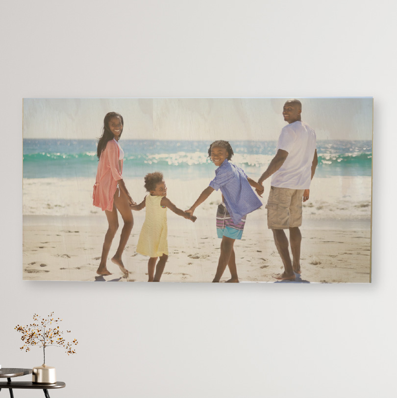 600x900mm birch wood photo print showing happy family holding hands on beach on natural wooden panel