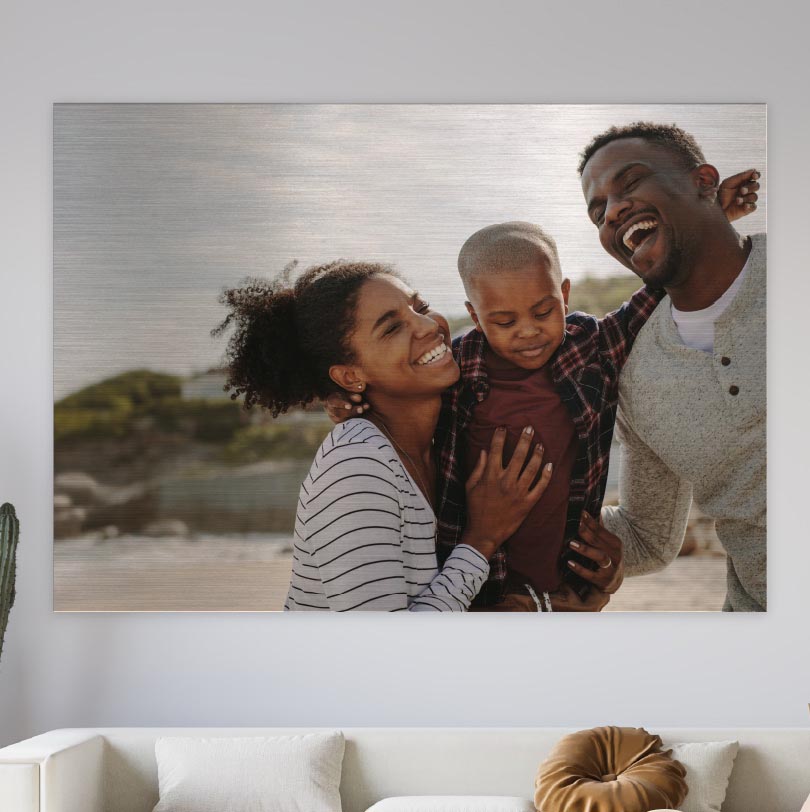 600x900mm brushed silver aluminium print with photo of mom dad and son laughing together at home or outdoors