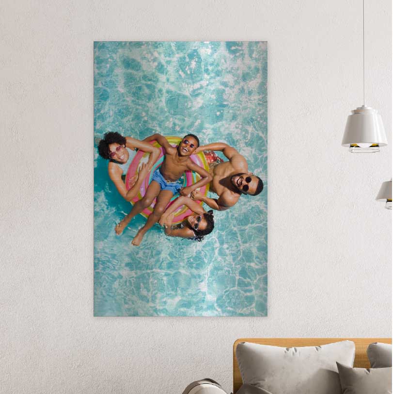 750x500mm brushed silver aluminium print with photo of family sitting on inflatable tube in swimming pool