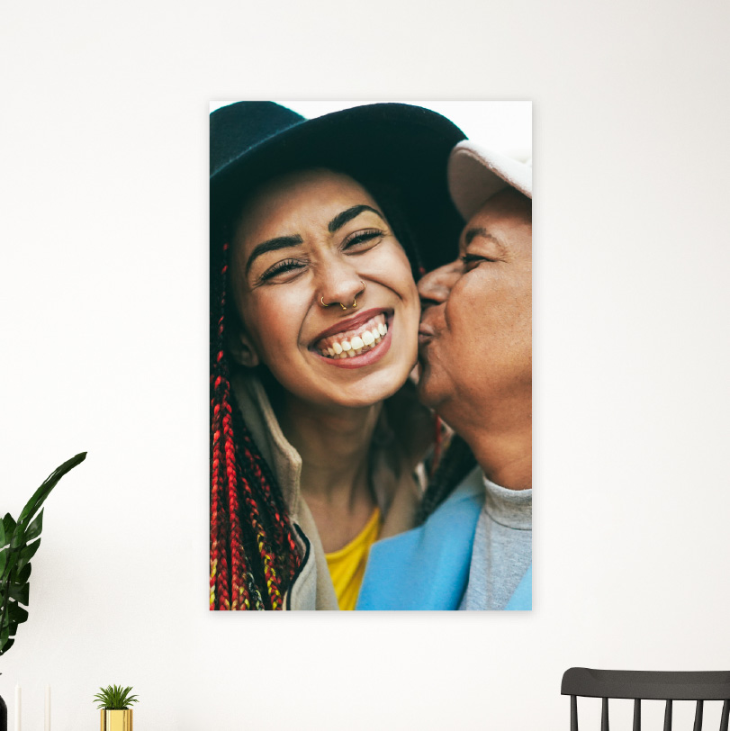 750x500mm foam board print with photo of mother kissing daughter on cheek affectionately indoors or outdoors