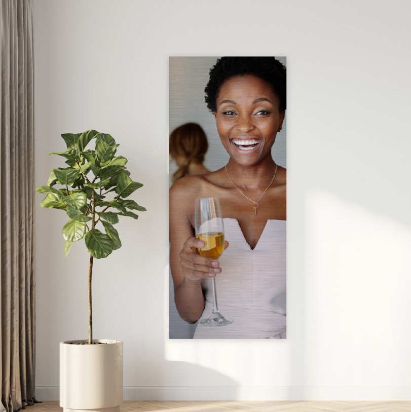 900x300mm brushed silver aluminium print with photo of bride holding champagne glass in celebration