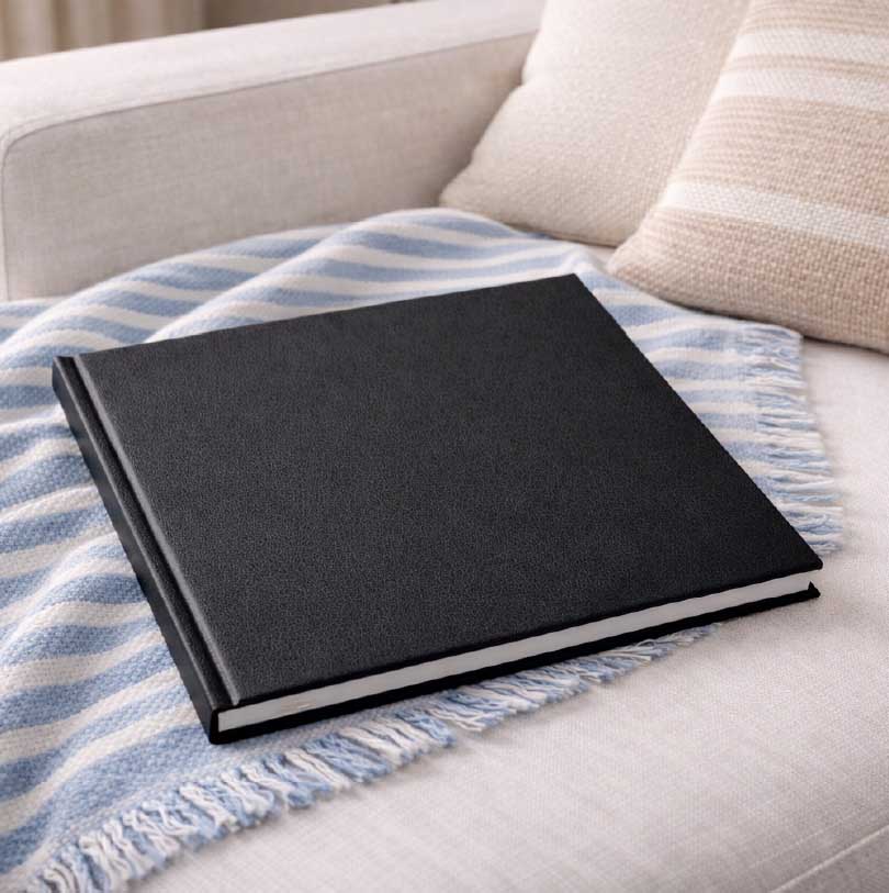 200x200mm lay-flat luxury hardcover photobook with flat opening pages and premium cover finish