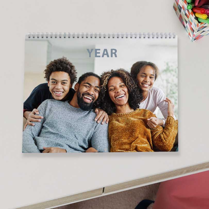 A4 landscape calendar with happy family cover photo showing a joyful family portrait used for personalised wall calendar design