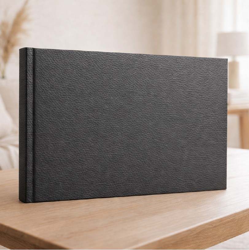 A4 landscape lay-flat luxury hardcover photobook with photographic print finish and flat opening pages showing panoramic spread