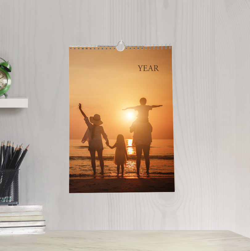 A4 portrait calendar with photo of family on beach at sunset showing warm sunset lighting and family seaside moment in wall calendar format