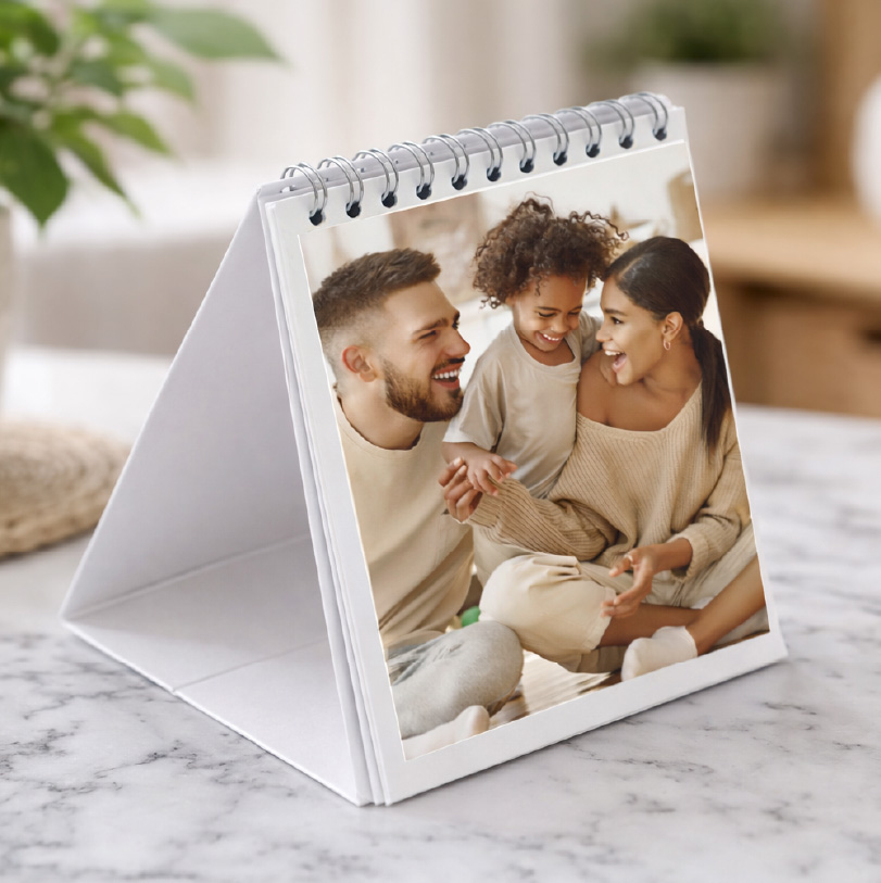 Polaroid calendar with photo of mom dad and daughter in a family portrait style used for personalised wall calendar design