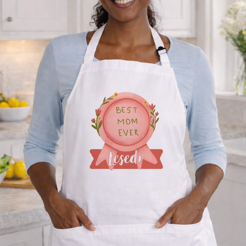 Adult apron worn by a lady featuring the text “Best Mom Ever”.