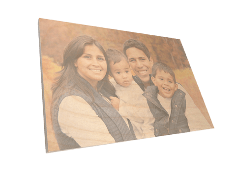 Family photo printed on birch wood panel with natural grain texture visible in the background.