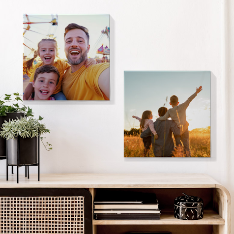 Happy family standing in front of wall decor