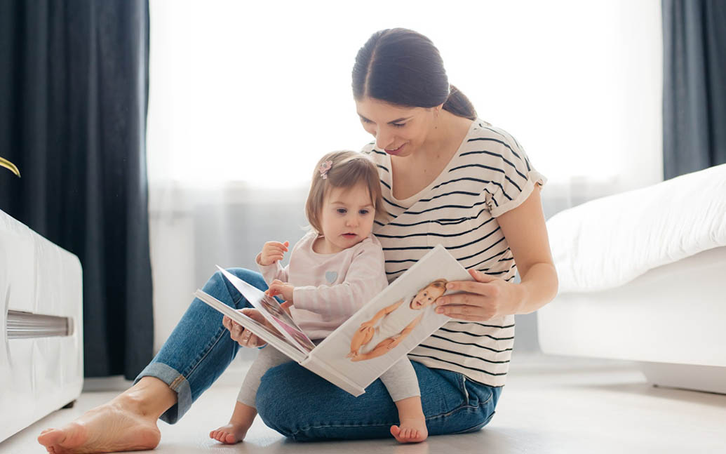 Mother and daughter looking at a photobook