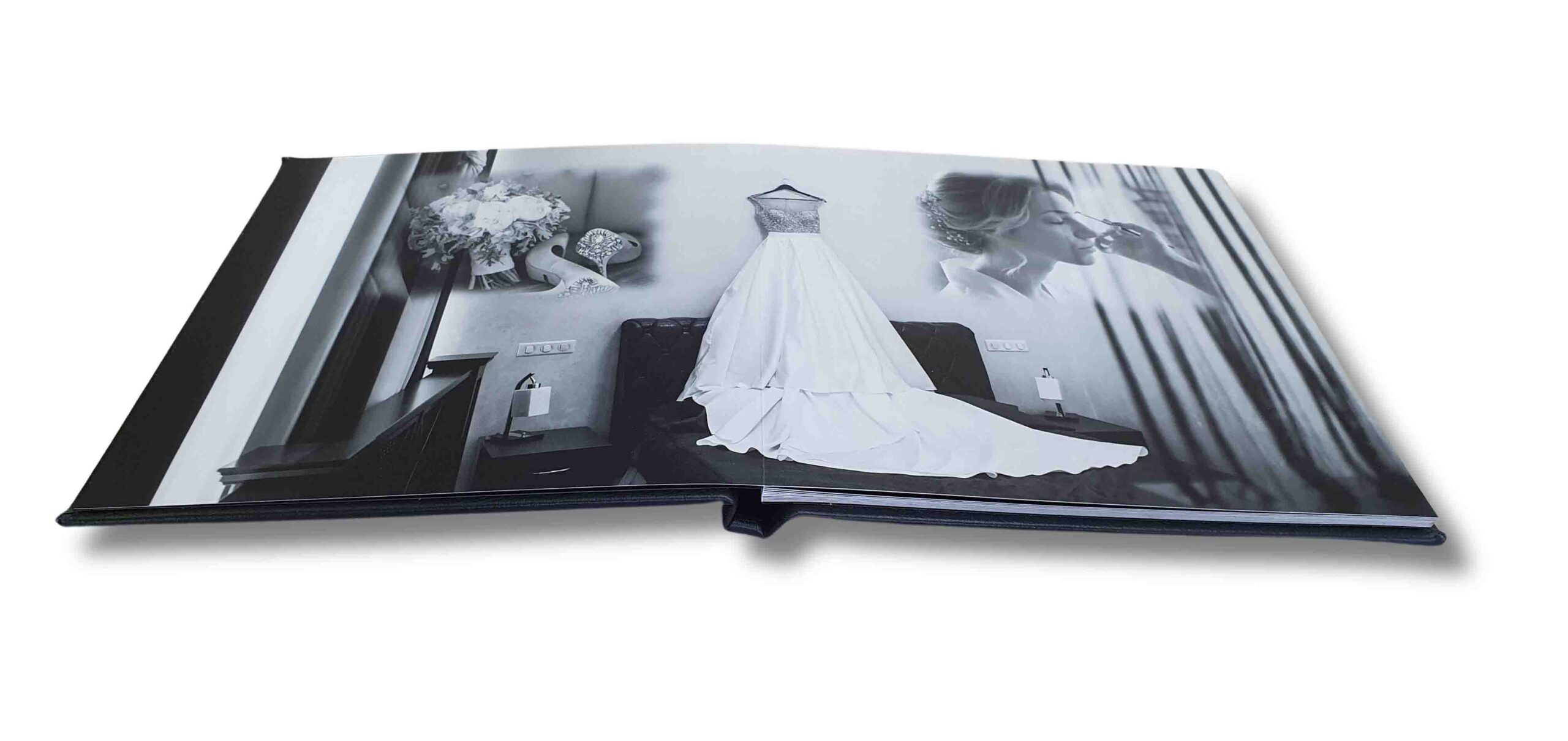 Open portrait lay flat wedding photobook with seamless pages, showcasing personalised wedding photos in a premium album design.