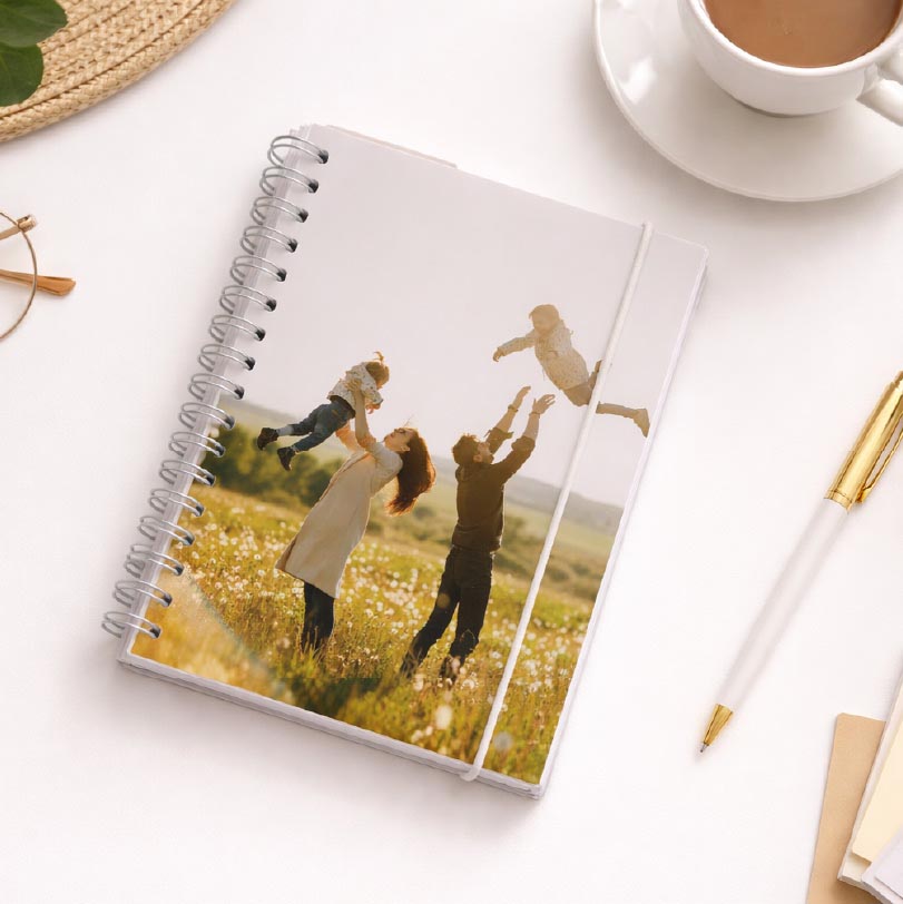 Personalised notebooks and journals displaying family photos on the covers, suitable for custom stationery gifts.