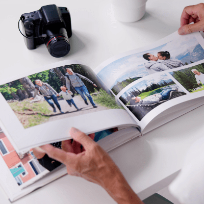 Photographer looking at a landscape photobook