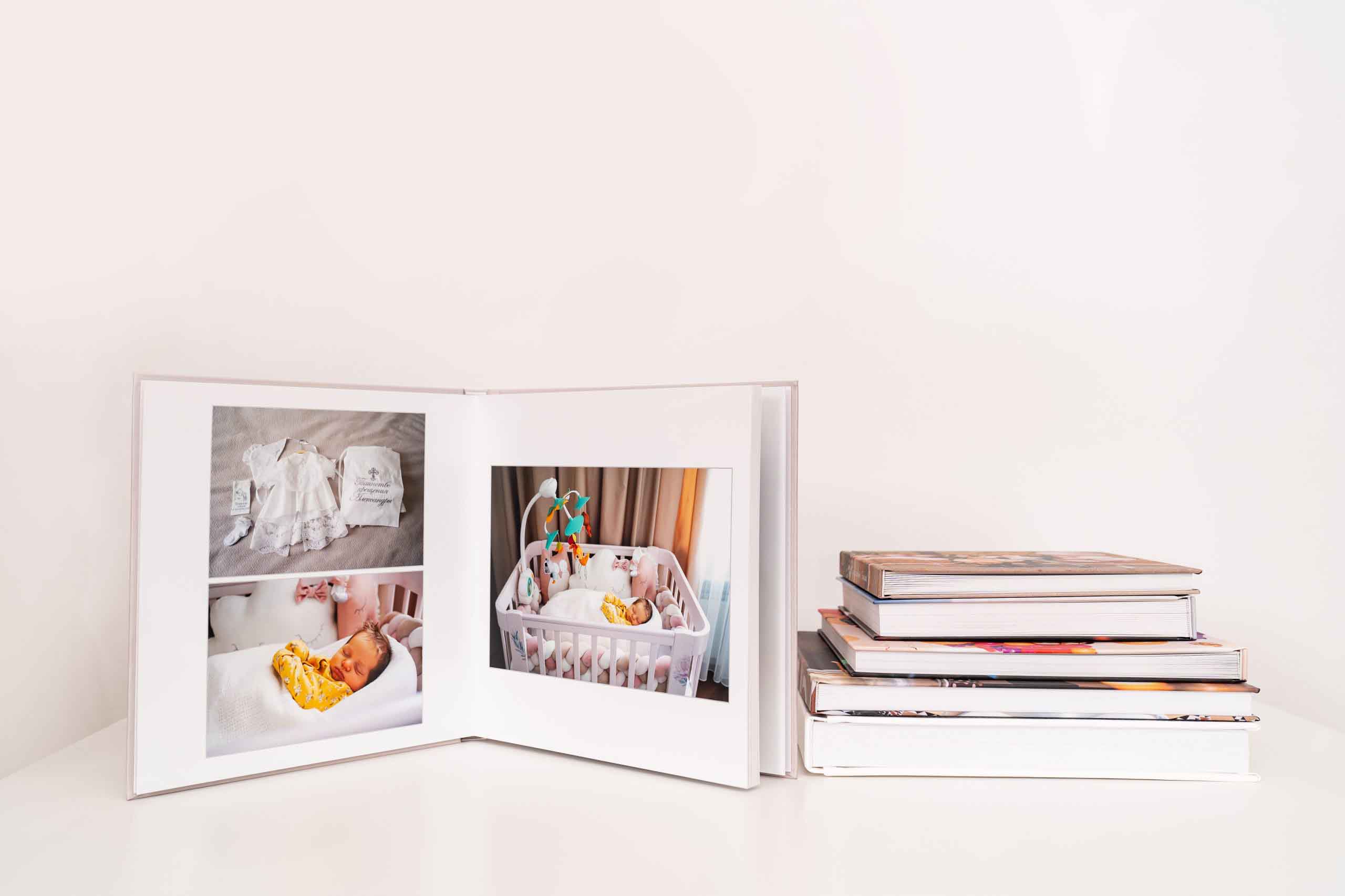 Collection of square lay flat photobooks with seamless page spreads, designed for personalised photo albums and premium memory keeping.