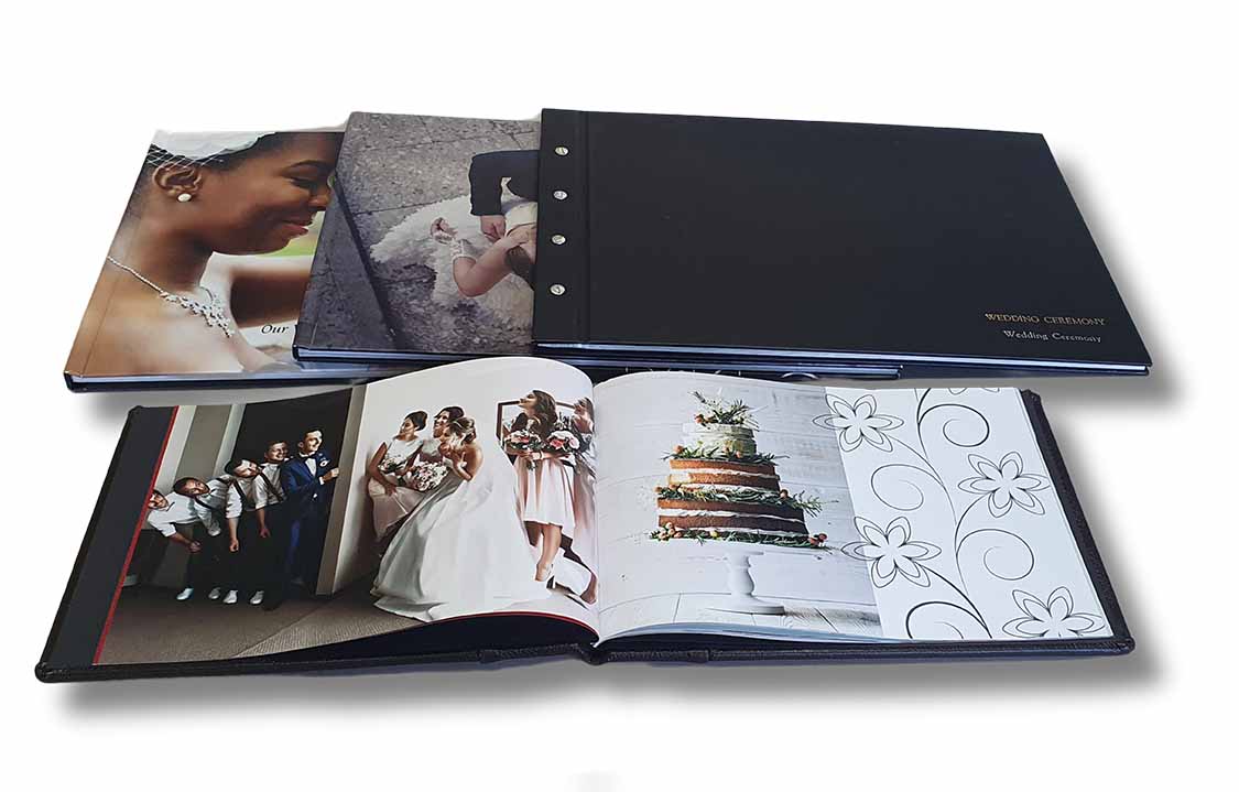 Wedding hardcover photobooks displayed together, showcasing premium printed wedding memories in a durable hardbound album format.