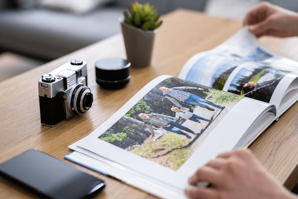 Woman photographer looking at a landscape photobook